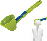 Green and blue measuring scoop pouring sugar into a glass