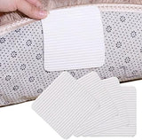White ribbed rug grip pads being applied to the underside of a rug