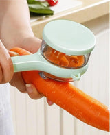Peeling a carrot with the mint and orange peeler over a sink