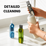 Cleaning a bottle at the sink with the brush, blue and green versions in front