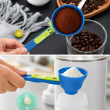 Green and blue measuring scoop lifting ground coffee, and filling a baby bottle