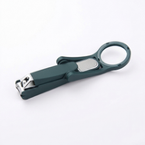 Nail clipper with the magnifier folded flat, seen from the side